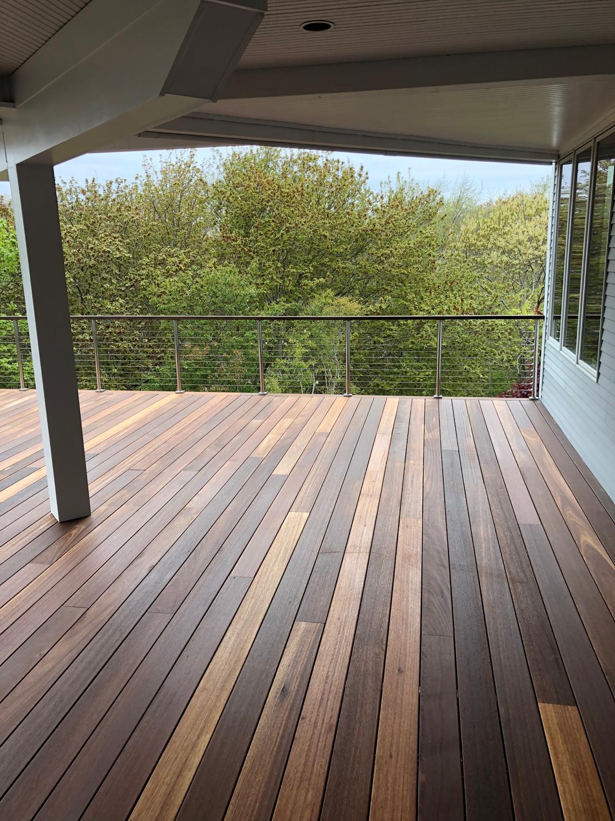 New wood deck stained by RG Pro Painters