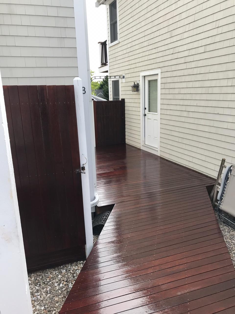 Dark stained deck boards and door