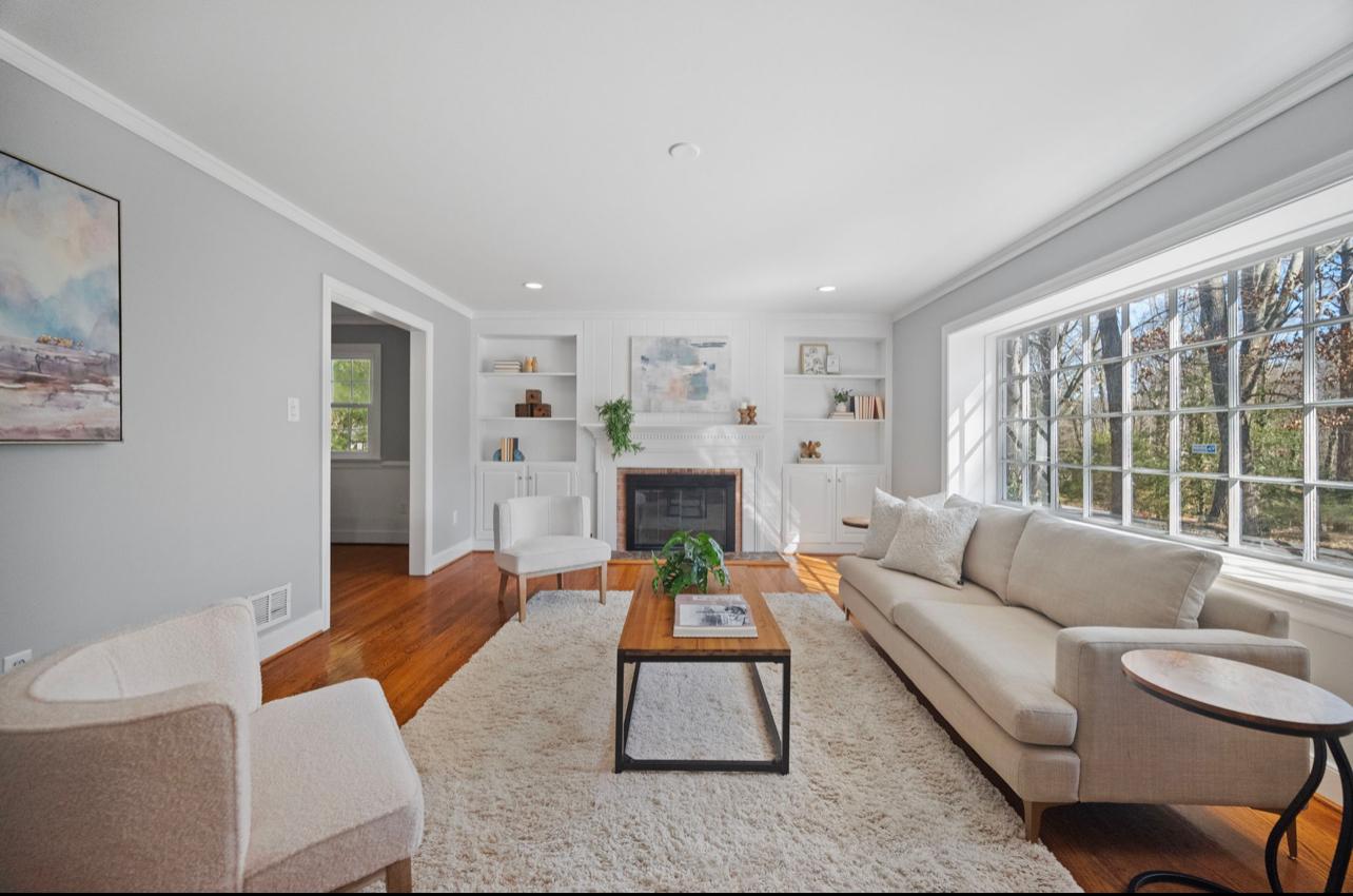 White living room with fireplace after interior repaint