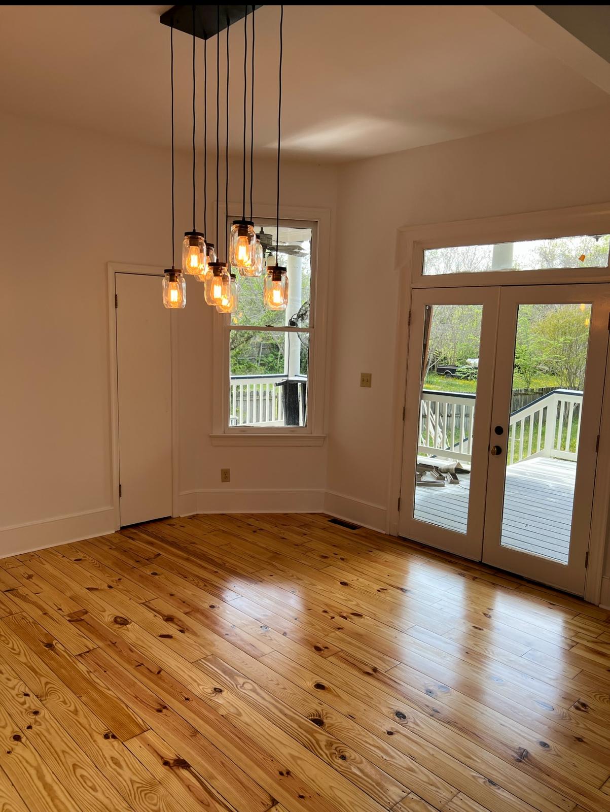 Dining room with fresh paint and chandelier