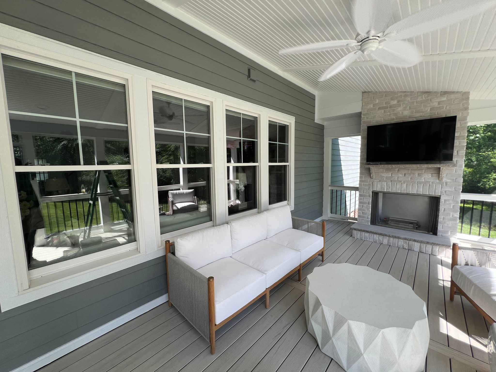 Covered porch with freshly painted ceiling and trim