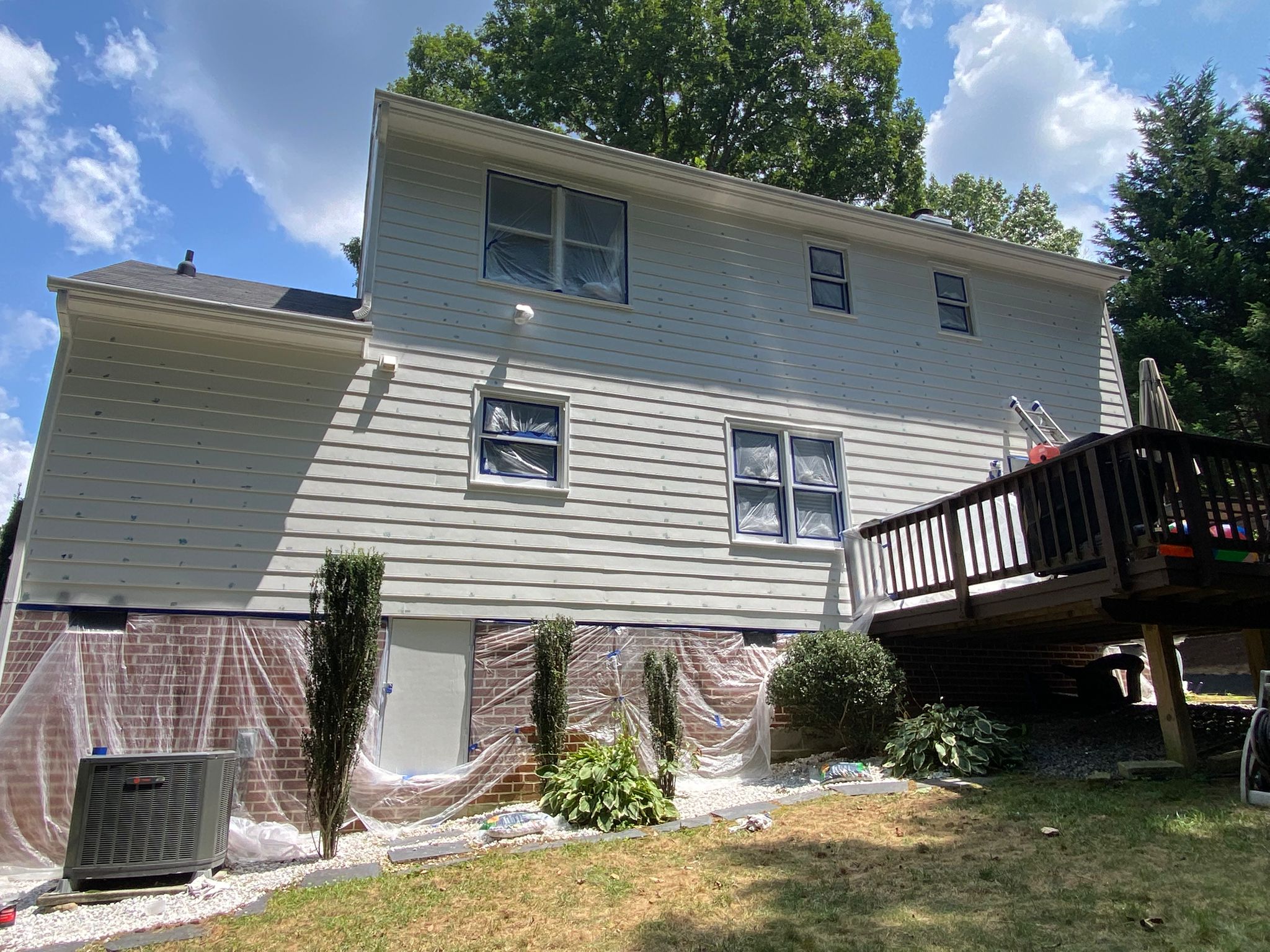 Home exterior prepped and masked for painting
