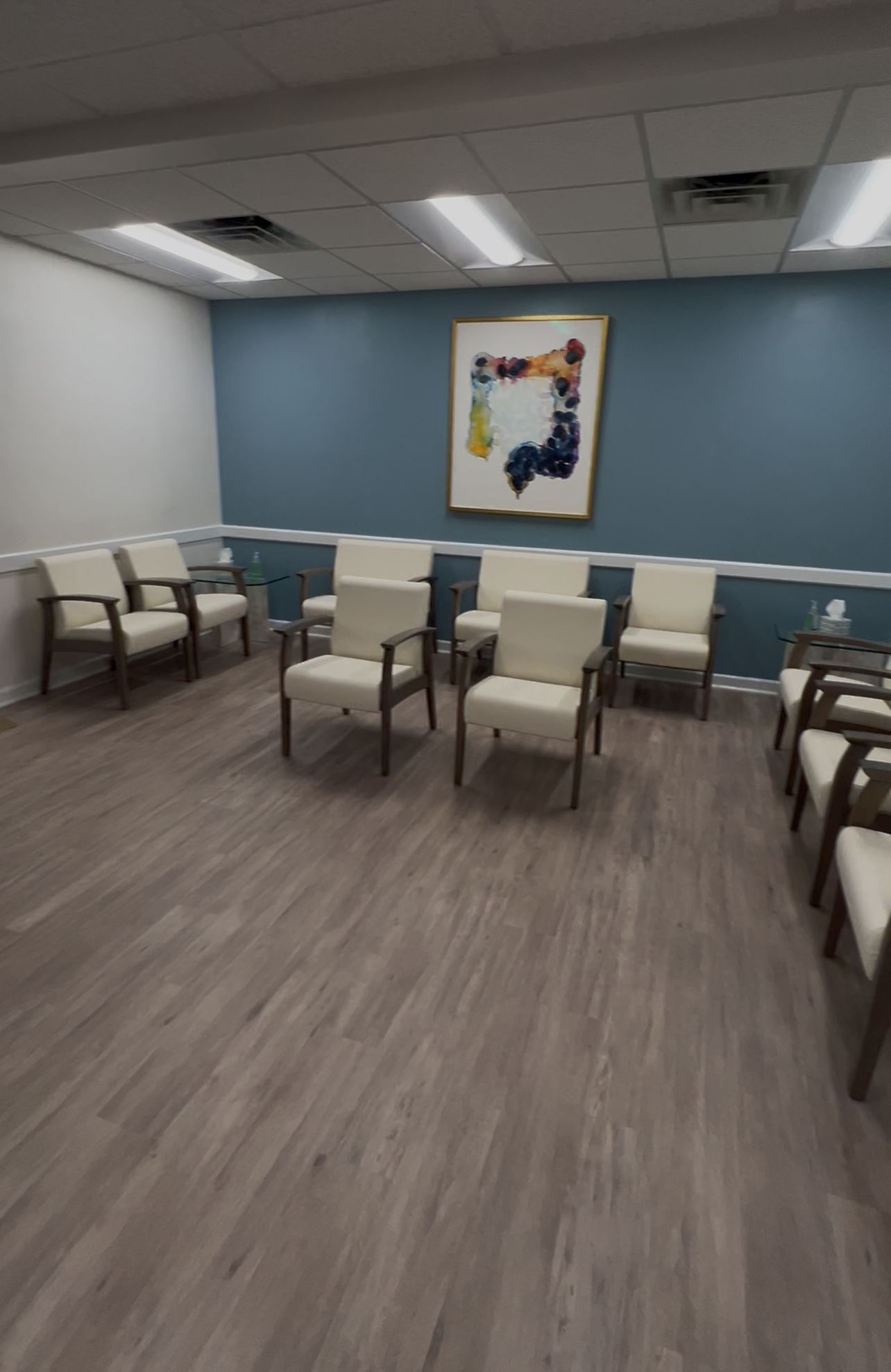 Office waiting room with blue accent wall repaint