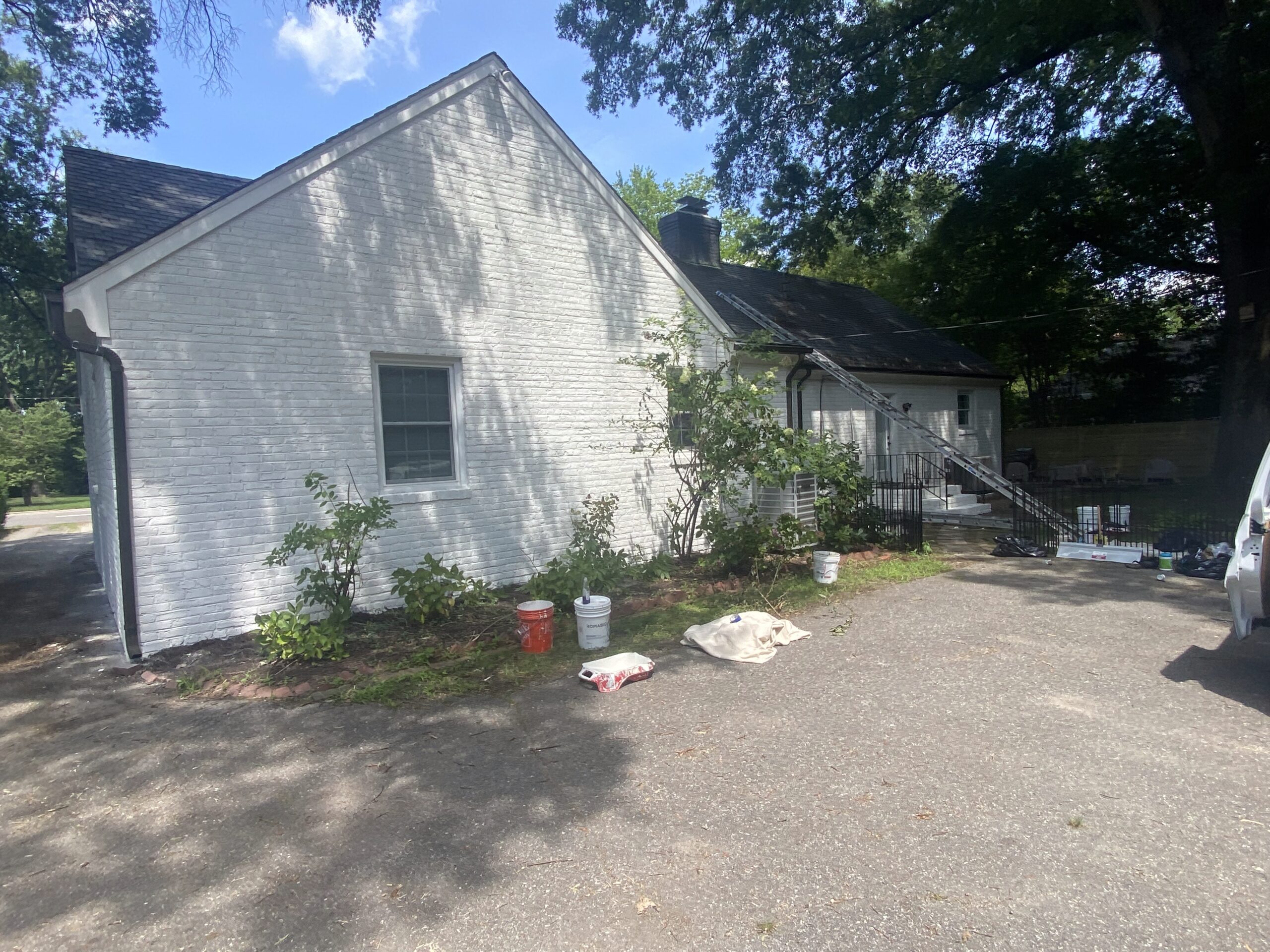 White cottage exterior repainted by RG Pro Painters