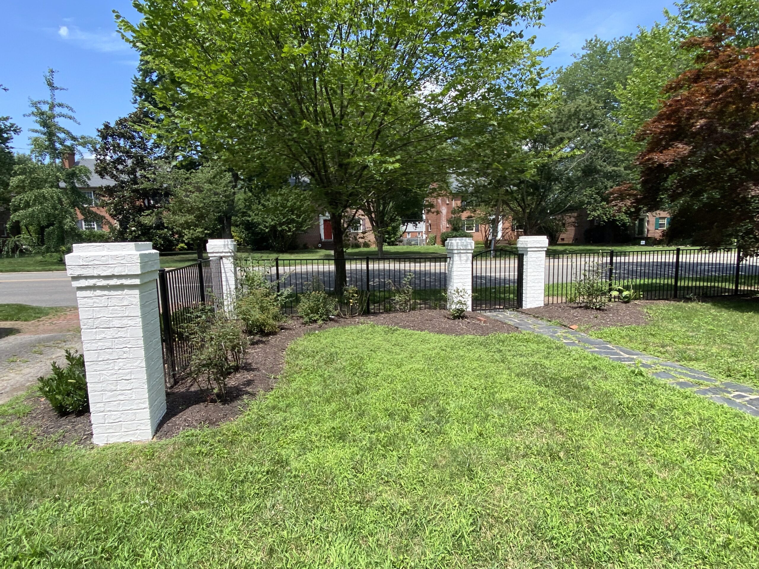 White painted home with front yard walkway