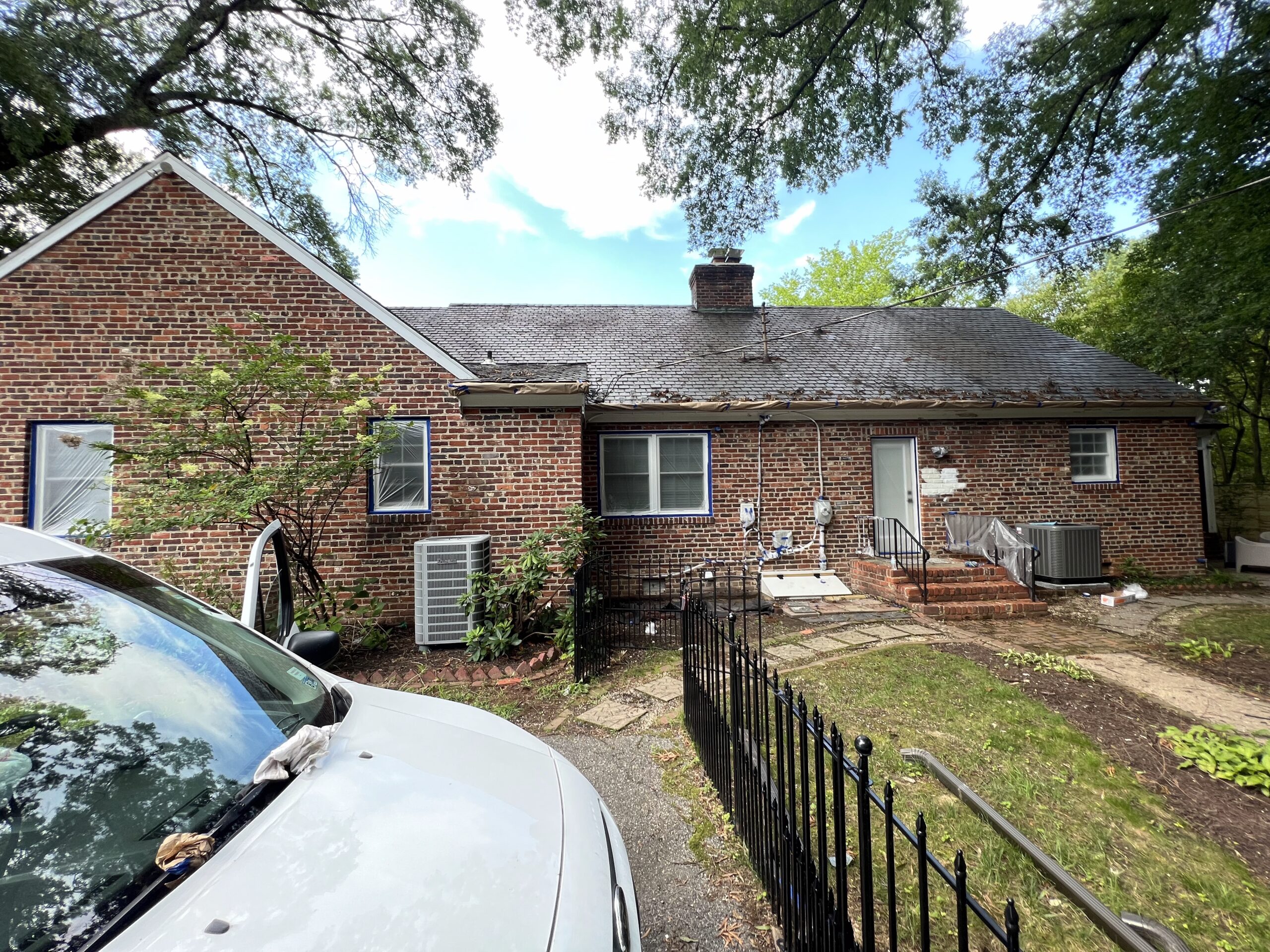 Brick house rear exterior during repaint
